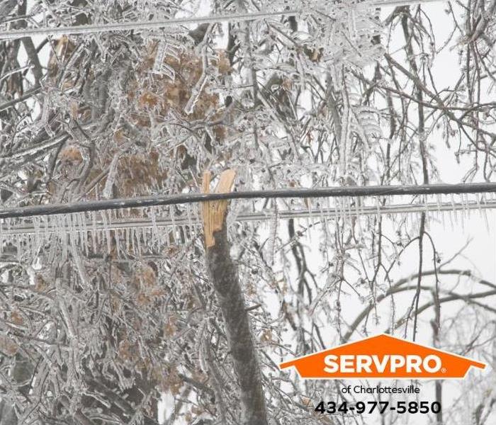 Ice hangs from powerlines causing a power outage.