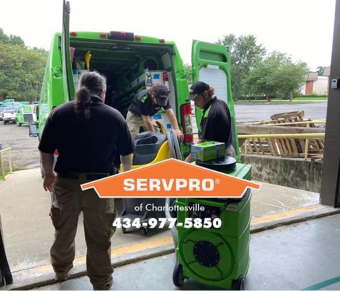 SERVPRO of Charlottesville technicians are loading equipment in response to a fire damage restoration call. 