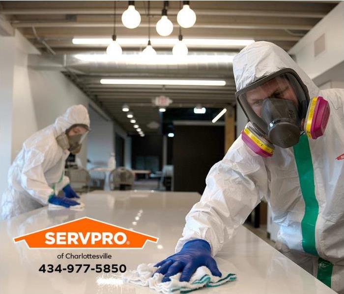 SERVPRO technicians clean an area exposed to a biohazard.